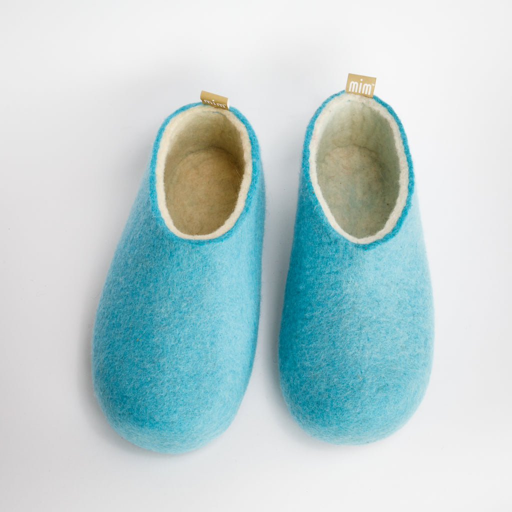 100% wool felt sky blue colour slippers with a natural undyed wool interior layer